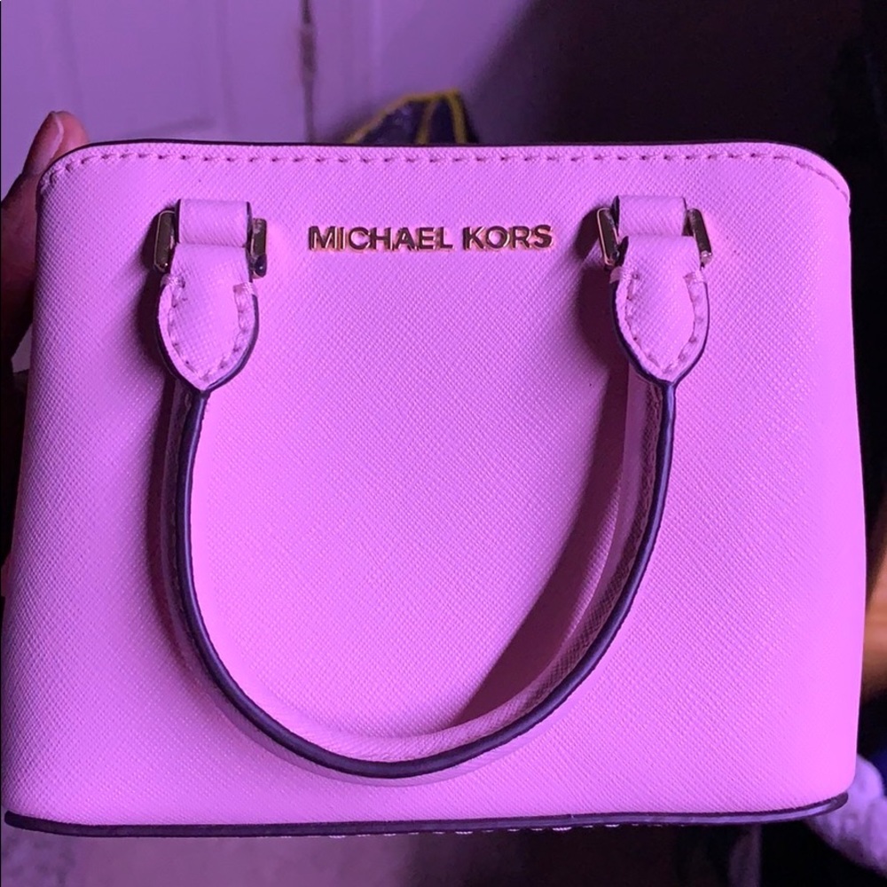 Mini light pink MK purse